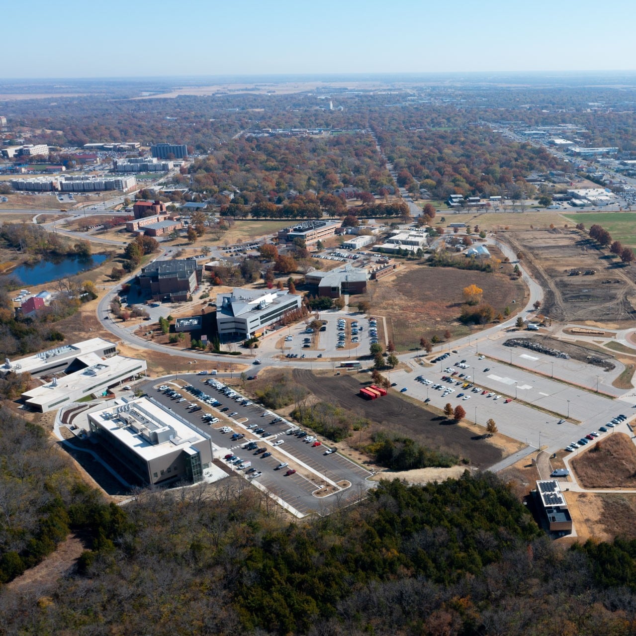 Drone shot of the Bioscience and Technology Business Incubator in Lawrence, KS and surrounding buildings.